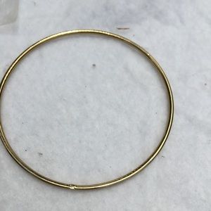 Modern gold tone smooth circle bangle bracelet